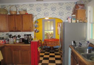 Updated kitchen behind the original swinging door