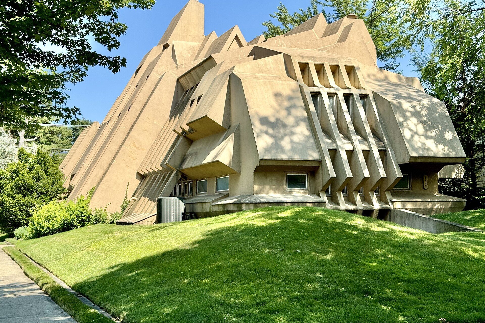 Board-formed concrete volumes at the street facade