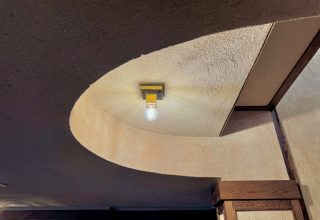 Stairwell lit by a full-length ridge skylight